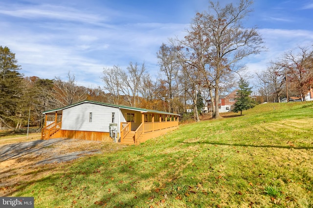 view of side of home featuring a yard