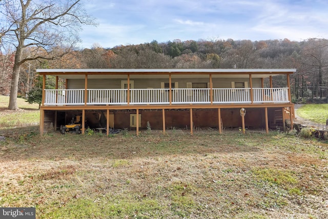 back of property featuring a deck