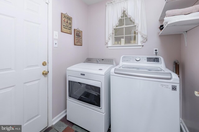 clothes washing area featuring washing machine and dryer