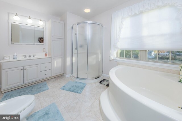 full bathroom with toilet, vanity, tile patterned floors, and independent shower and bath