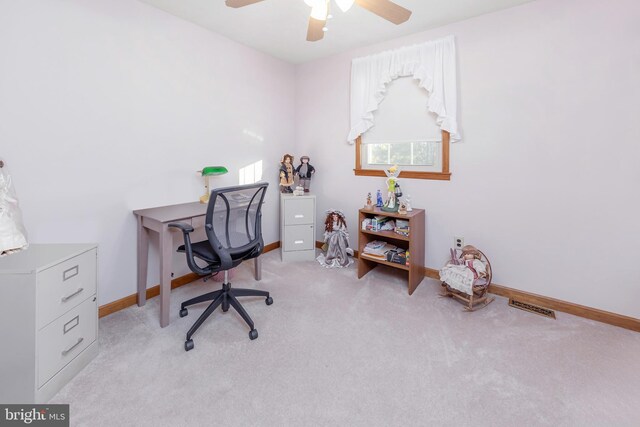 office space with light carpet and ceiling fan