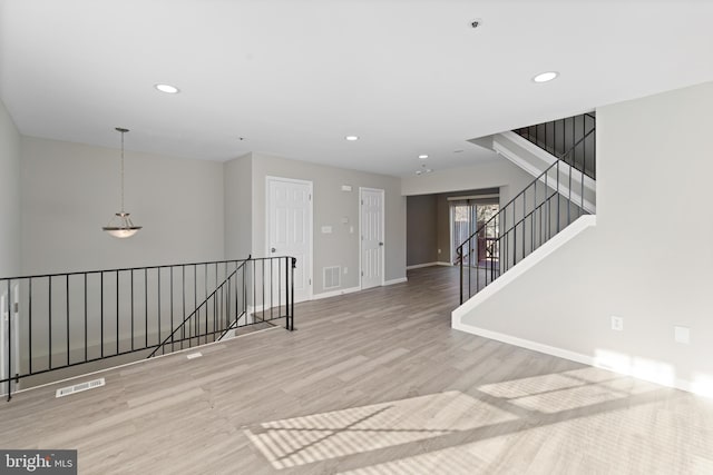 unfurnished room featuring light hardwood / wood-style floors