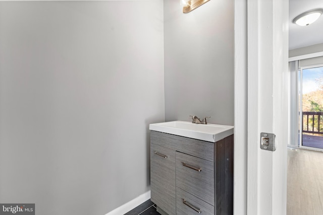 bathroom featuring hardwood / wood-style floors and vanity