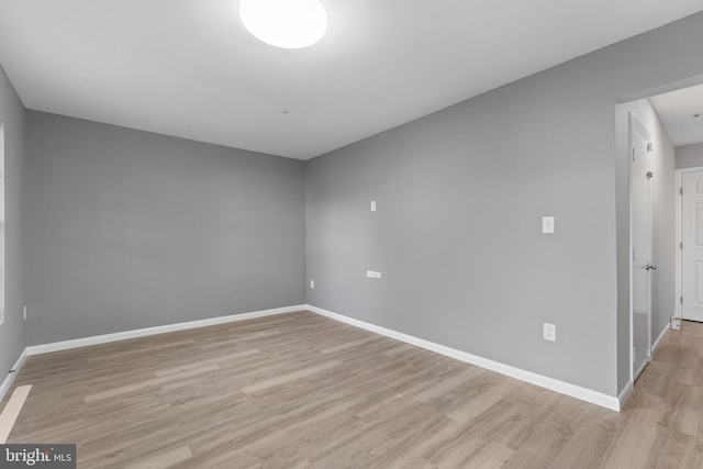 unfurnished room featuring light hardwood / wood-style floors