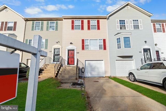 townhome / multi-family property featuring a garage