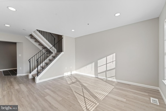 spare room featuring light wood-type flooring
