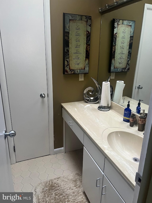 bathroom with tile patterned flooring and vanity