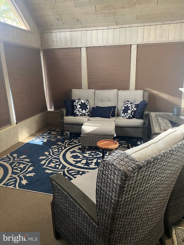 sunroom / solarium featuring wood ceiling and lofted ceiling