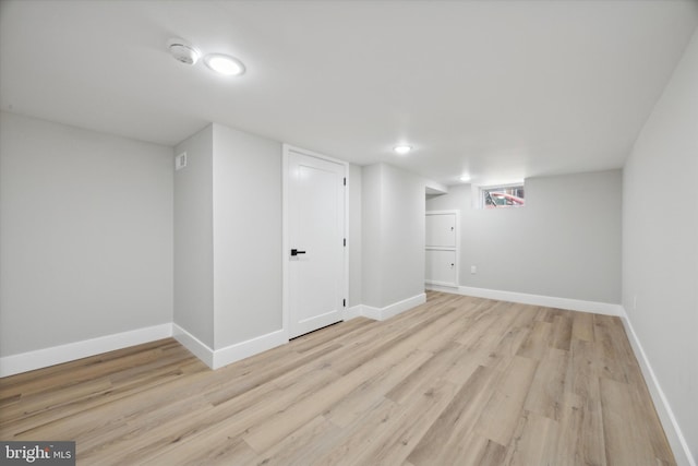 basement featuring light hardwood / wood-style floors