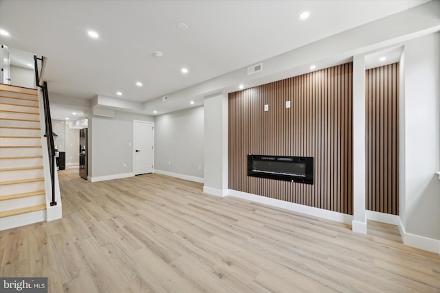 unfurnished living room featuring light hardwood / wood-style floors