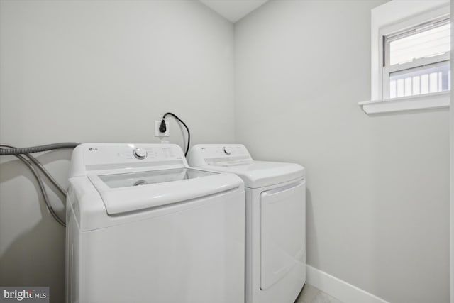 laundry room featuring separate washer and dryer