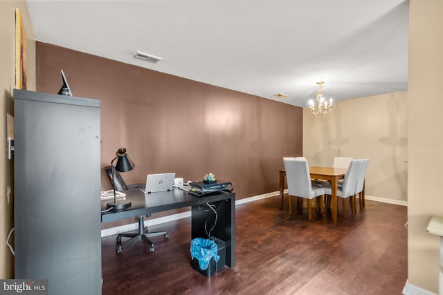 office area with a notable chandelier and dark hardwood / wood-style floors