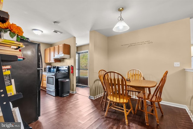 dining space featuring dark hardwood / wood-style flooring