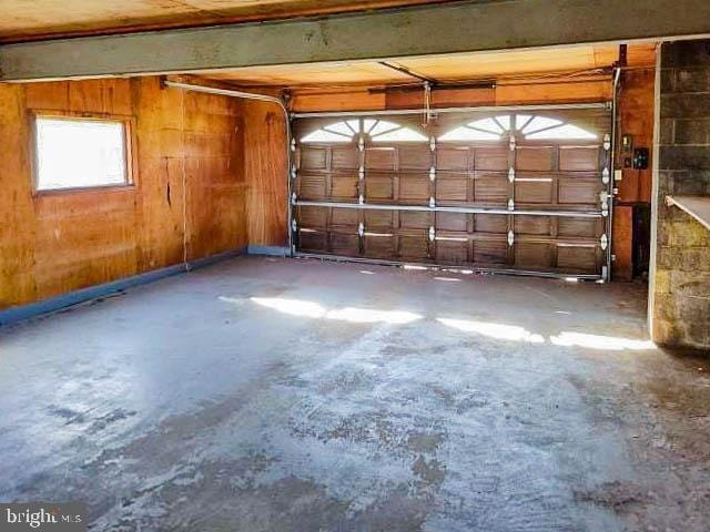 garage with wood walls