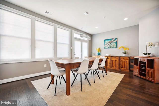 dining room featuring dark hardwood / wood-style flooring