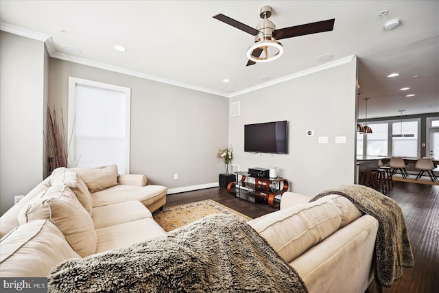 living room featuring ceiling fan, dark hardwood / wood-style flooring, and ornamental molding