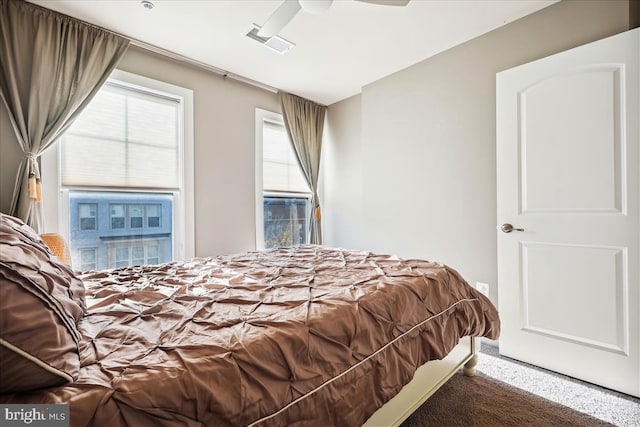 carpeted bedroom with ceiling fan