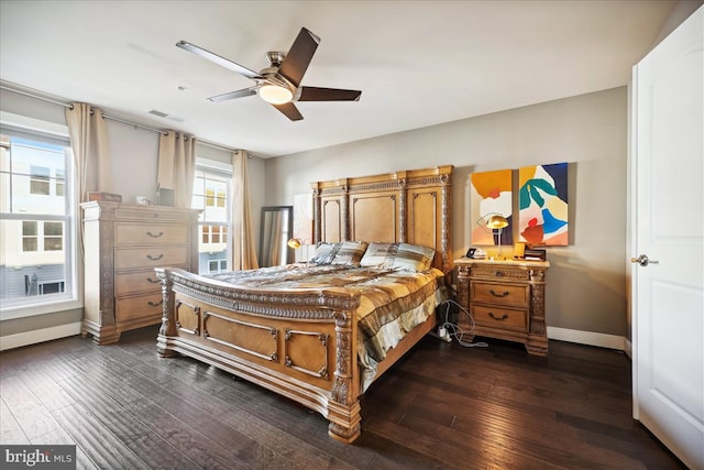 bedroom with ceiling fan and dark wood-type flooring