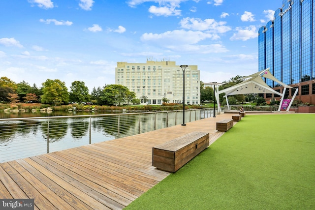 view of dock featuring a gazebo and a water view