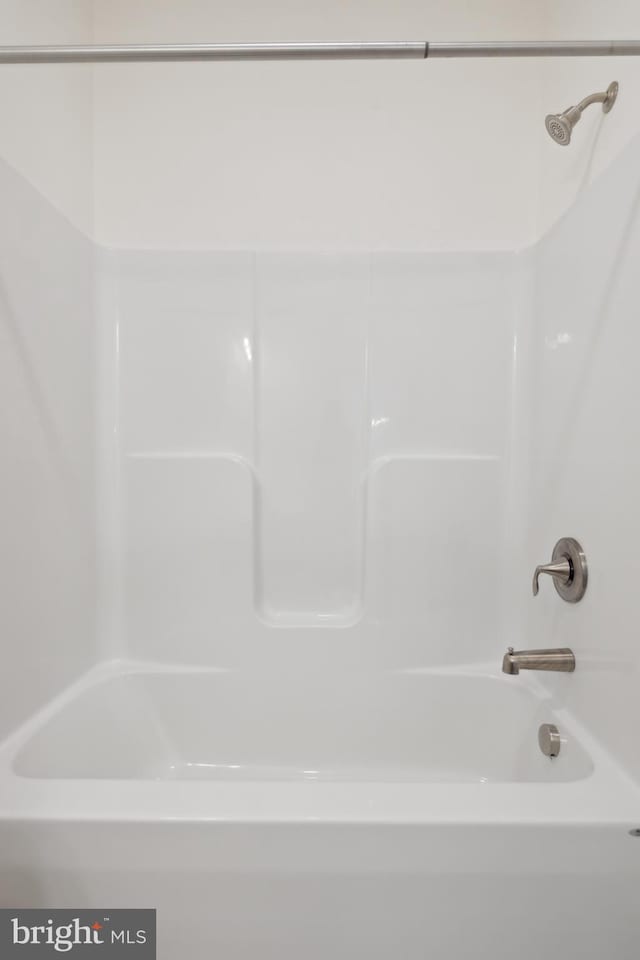 bathroom with shower / tub combination