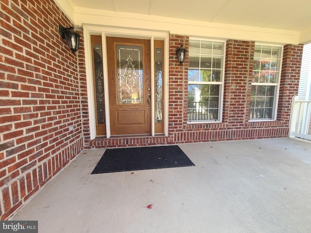 property entrance featuring covered porch