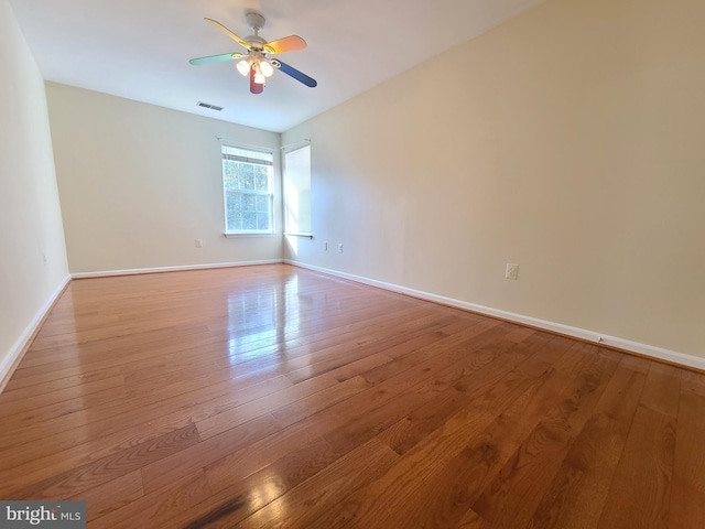 unfurnished room with light hardwood / wood-style flooring and ceiling fan