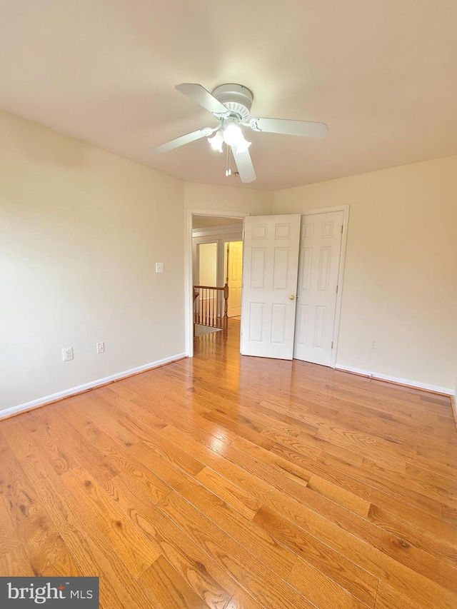 unfurnished bedroom with light wood-type flooring and ceiling fan