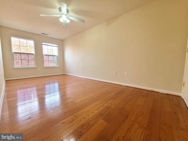 spare room featuring ceiling fan and light hardwood / wood-style flooring