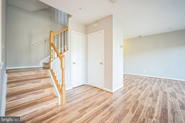 staircase featuring hardwood / wood-style floors