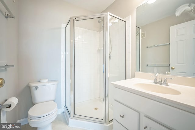 bathroom featuring vanity, toilet, and an enclosed shower