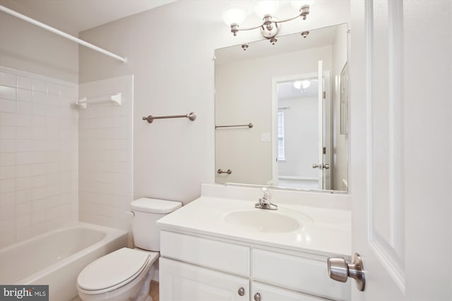 full bathroom with vanity, toilet, and tiled shower / bath