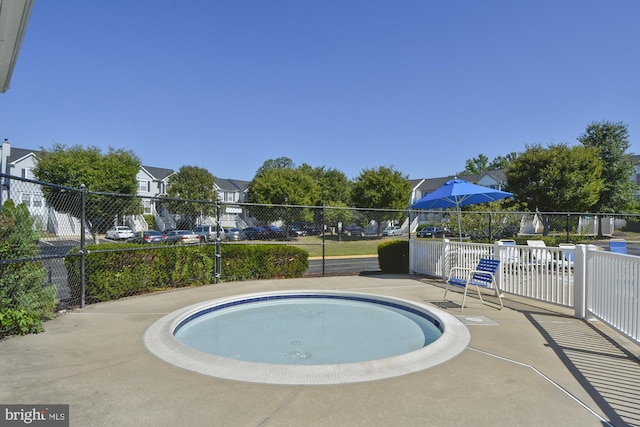 view of pool featuring a hot tub