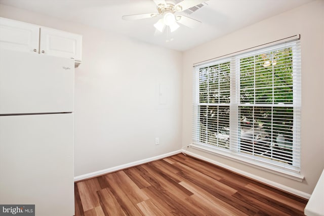 empty room featuring wood-type flooring and ceiling fan