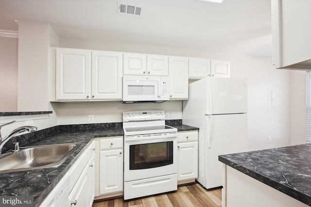 kitchen featuring white cabinets, light hardwood / wood-style floors, sink, and white appliances