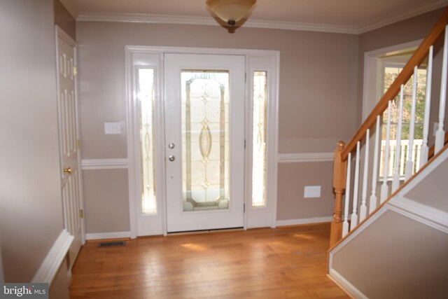 531 Washout Ln, Winchester, VA 22603 - entrance foyer featuring crown molding, stairs, plenty of natural light, and wood finished floors