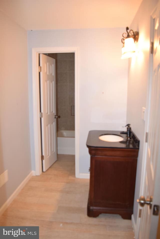 531 Washout Ln, Winchester, VA 22603 - full bath with walk in shower, a bathtub, wood finished floors, vanity, and baseboards