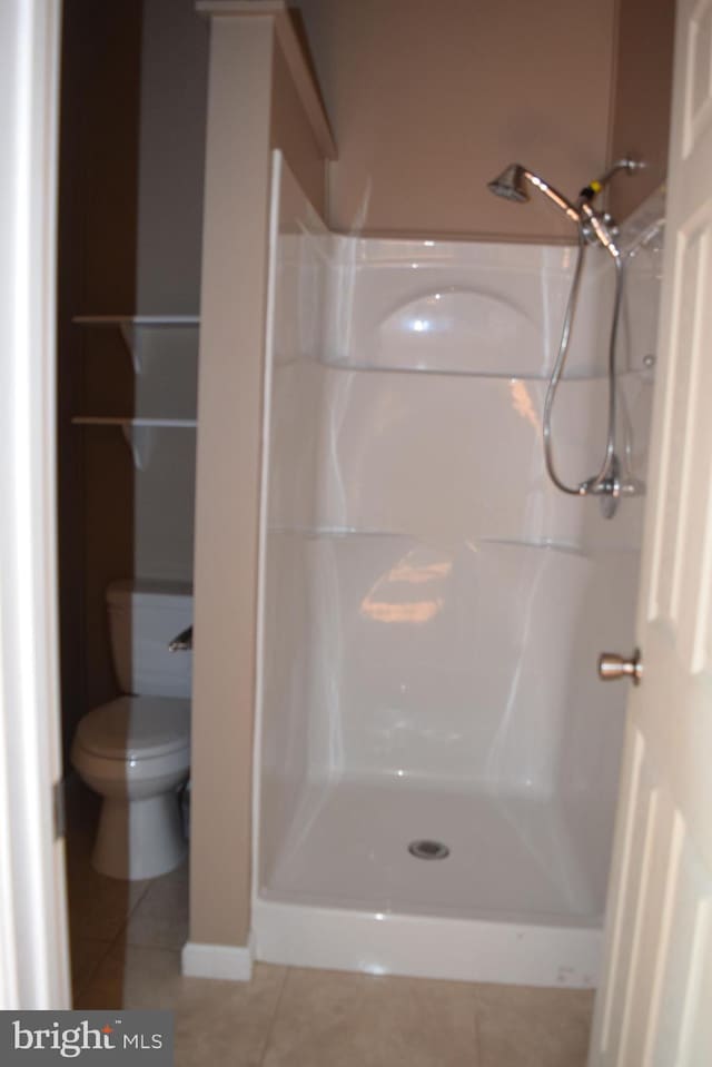 531 Washout Ln, Winchester, VA 22603 - full bath featuring a stall shower, tile patterned flooring, and toilet