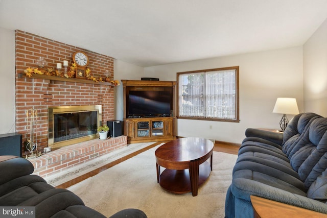 living room featuring a fireplace and light hardwood / wood-style flooring