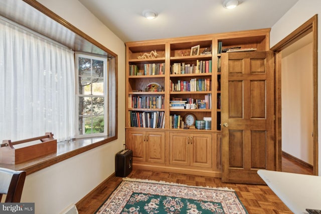 sitting room featuring parquet floors