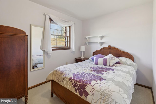 bedroom featuring light carpet