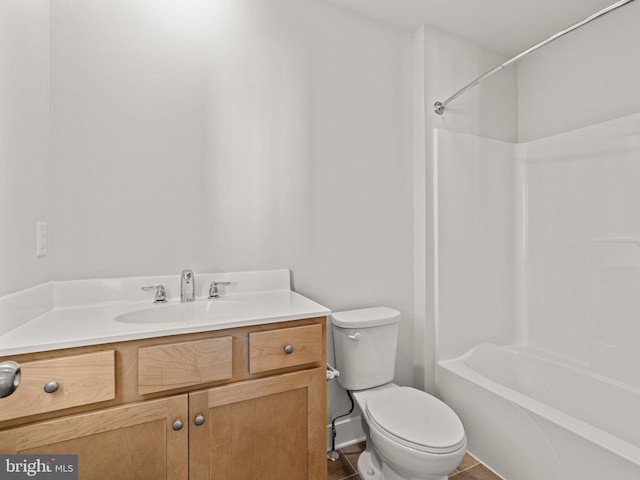 full bathroom featuring tile patterned floors, shower / washtub combination, vanity, and toilet