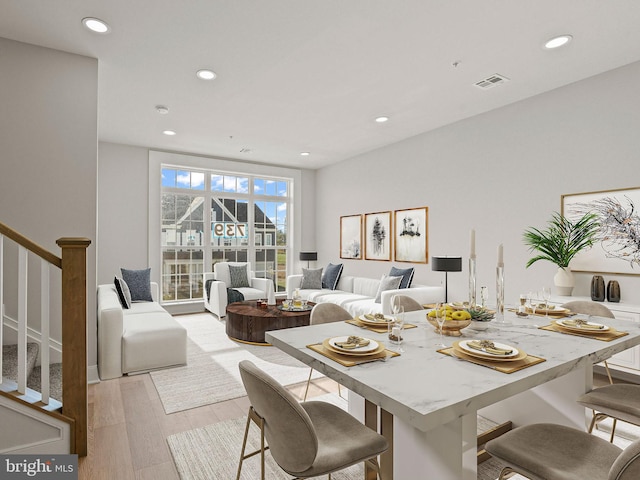 dining area with light hardwood / wood-style flooring