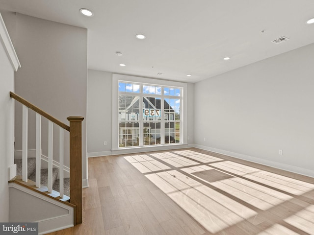 unfurnished room with light hardwood / wood-style floors