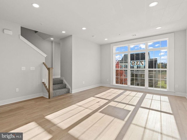 unfurnished living room with light hardwood / wood-style floors