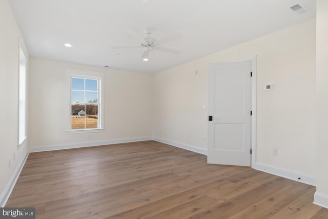 unfurnished room featuring ceiling fan and light wood-type flooring