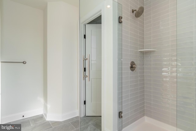 bathroom featuring tile patterned flooring and walk in shower