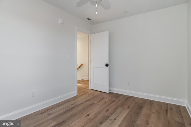 unfurnished room with ceiling fan and light hardwood / wood-style floors