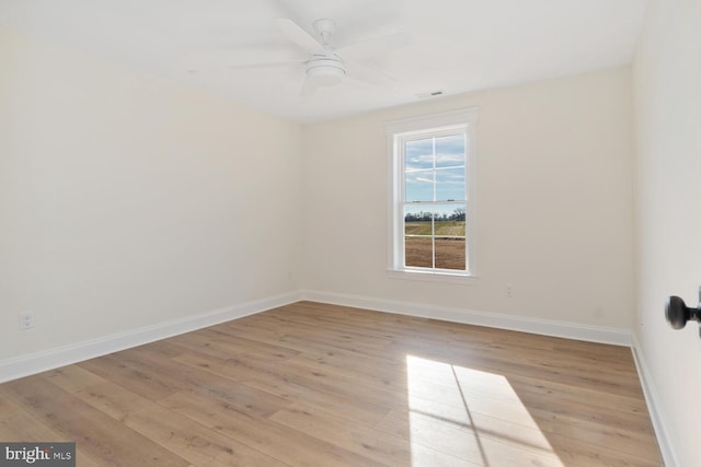 unfurnished room with ceiling fan and light wood-type flooring