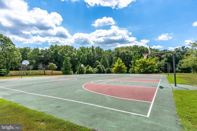 view of sport court featuring a yard