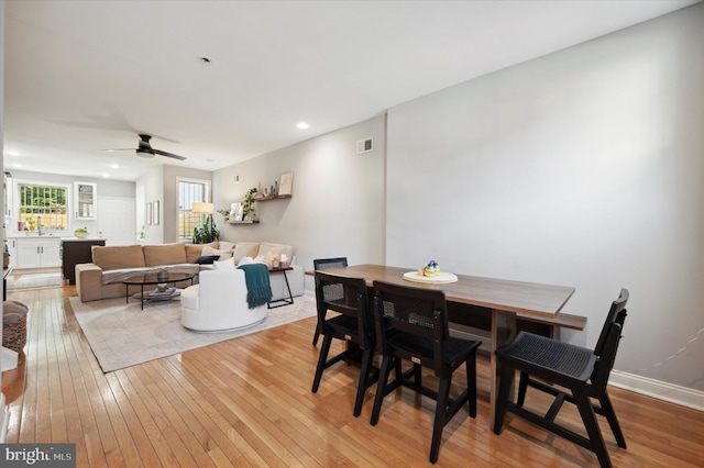 dining room featuring ceiling fan and light hardwood / wood-style flooring